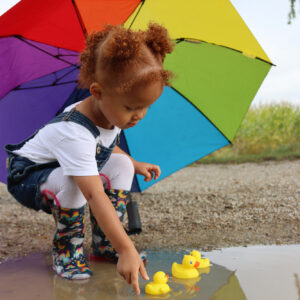 Three year old with ducks